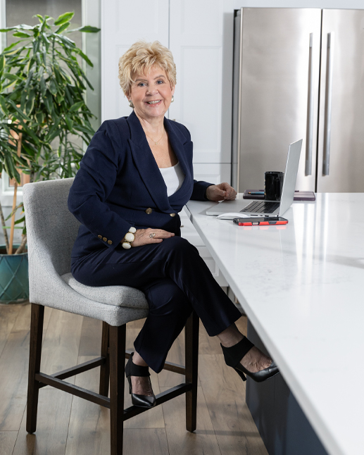 Portrait of Susan McKillop with clients in home